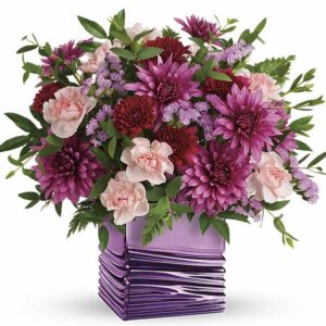 purple mums with pink flowers in vase