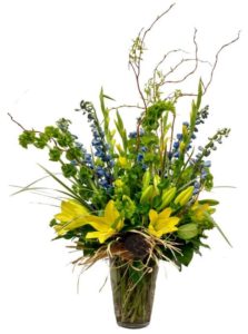 Good spring vibes resonate from this gorgeous design! Yellow Lilies, Blue Delphinium, Yellow Gladiolas and Curly Willow accentuate this wild spring look. 