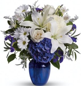 In this arrangement, the serenity of the color blue along with the purity of intention symbolized by white will let the family know you are sending your calm strength